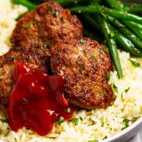 Homemade pork sausage patties on garlic rice