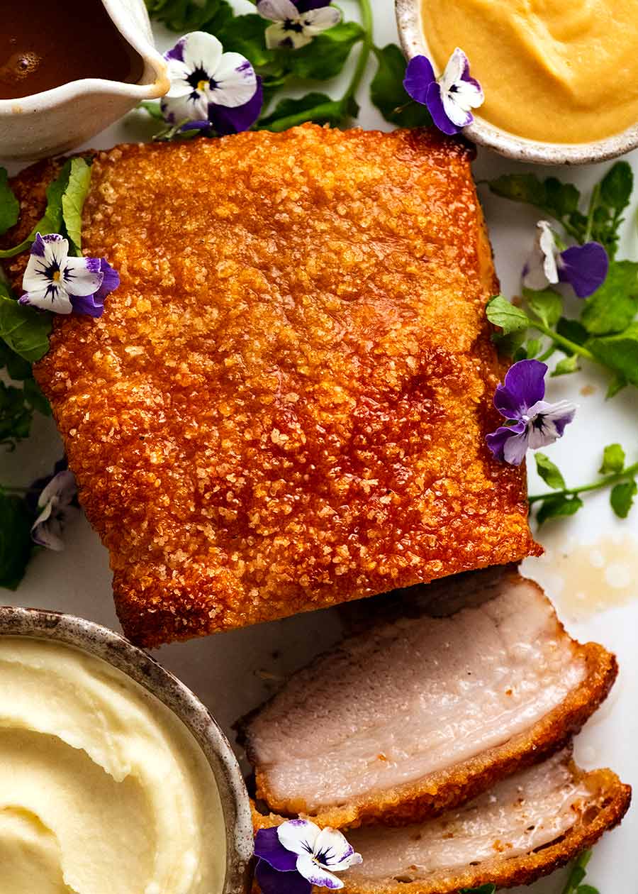 Overhead photo of Slow Roasted Crispy Pork Belly with Apple Sauce and Jus